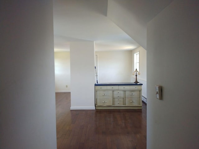 hallway featuring dark hardwood / wood-style floors