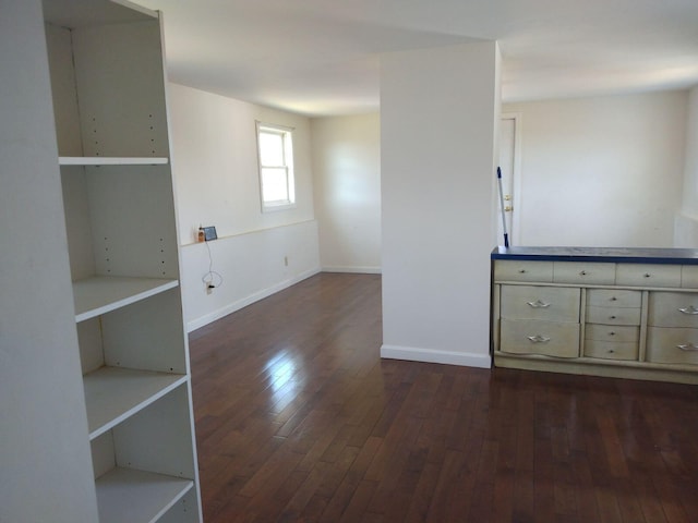 unfurnished room featuring dark hardwood / wood-style floors