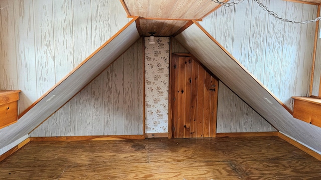 additional living space with hardwood / wood-style floors and wood ceiling