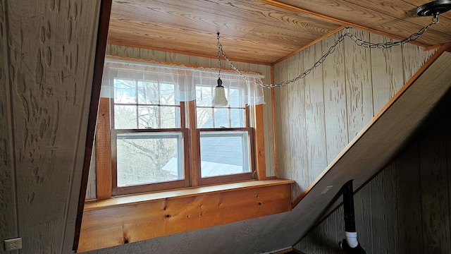 details with wood ceiling and wood walls