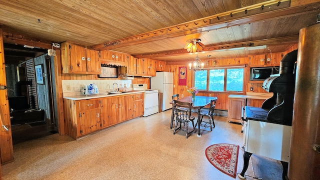 kitchen with sink, wood ceiling, a chandelier, white appliances, and beam ceiling