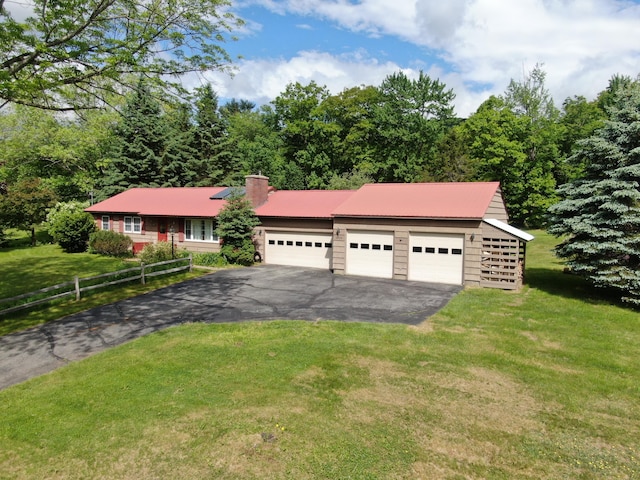 ranch-style home with a garage and a front yard