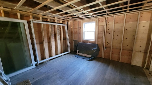 miscellaneous room featuring dark wood-type flooring