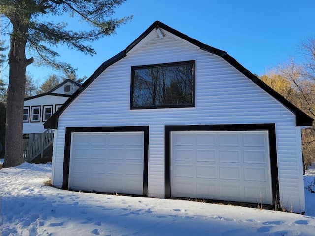 view of snow covered garage