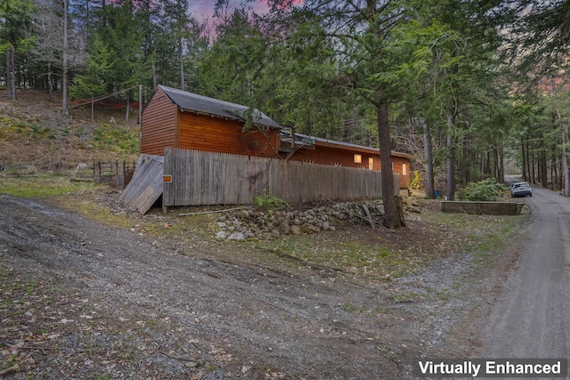 view of property exterior at dusk