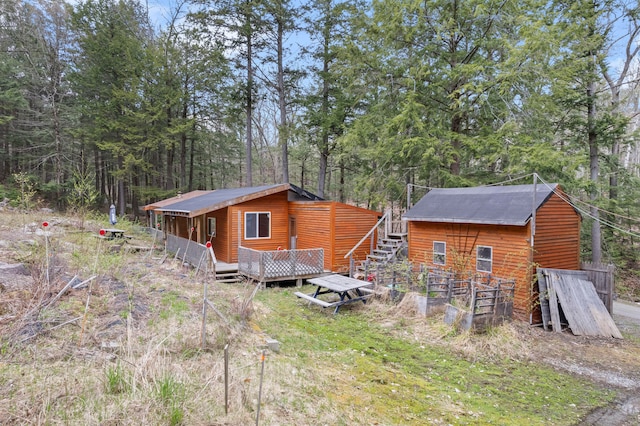 view of front of property with a wooden deck