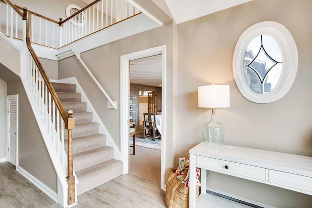 stairs featuring wood-type flooring