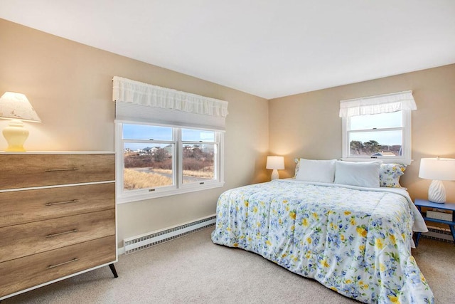 carpeted bedroom with a baseboard radiator