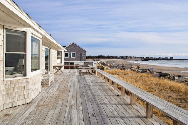 wooden terrace with a water view