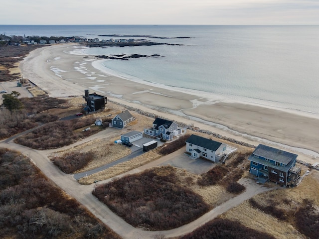 bird's eye view featuring a view of the beach and a water view