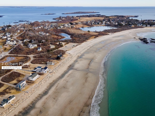 birds eye view of property featuring a water view and a view of the beach