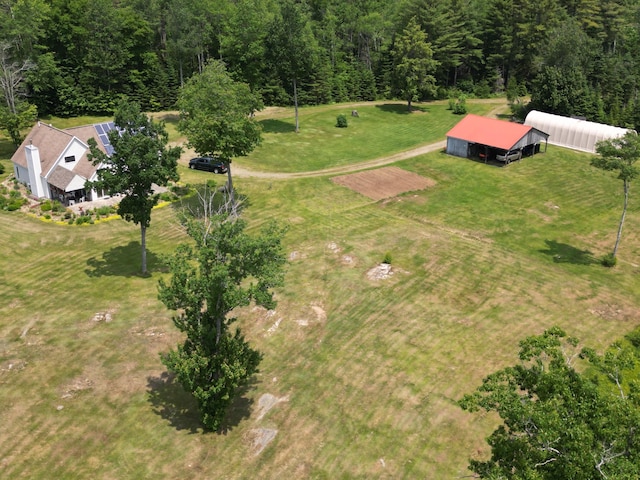 birds eye view of property with a rural view