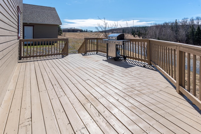 wooden terrace featuring grilling area