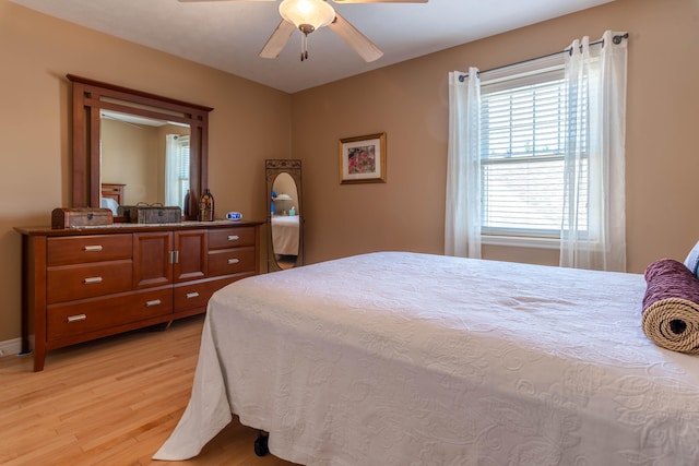 bedroom featuring light wood-type flooring and ceiling fan