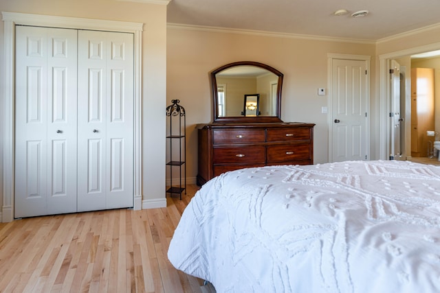 bedroom with ornamental molding and light hardwood / wood-style floors