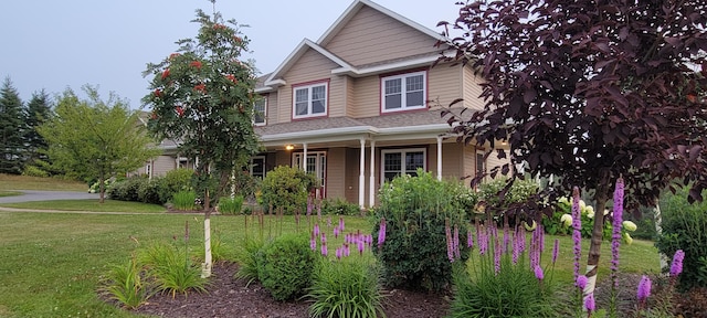 craftsman-style house with a front lawn