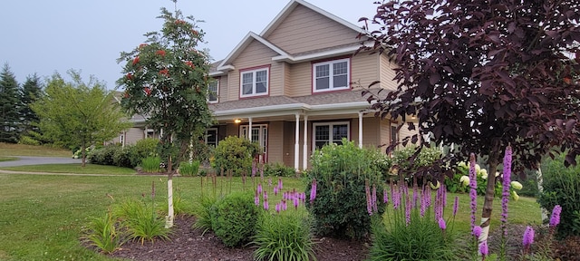149 Bellevue St, Madawaska, ME 04756 - craftsman-style house featuring a front lawn and a porch