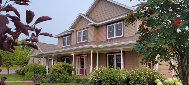 149 Bellevue St, Madawaska, ME 04756 - view of front of home featuring covered porch and roof with shingles