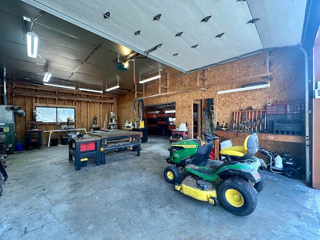 garage featuring a garage door opener and a workshop area