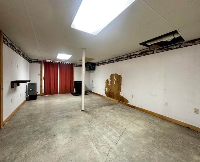 basement featuring a drop ceiling