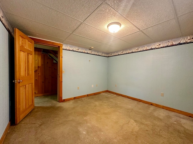 unfurnished bedroom featuring a drop ceiling