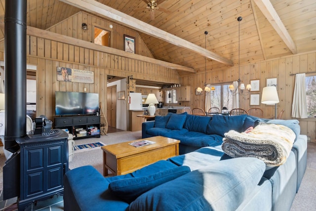 living room with wooden ceiling, wood walls, and carpet