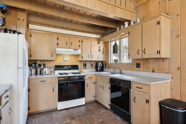 kitchen featuring dark tile flooring, beam ceiling, white appliances, and sink