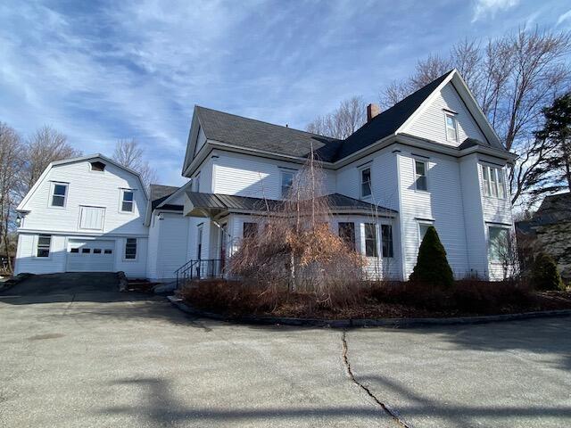 114 Exchange St, Ashland, ME 04732 - view of front of home featuring a garage