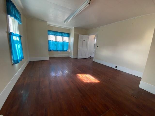 empty room featuring dark wood-type flooring