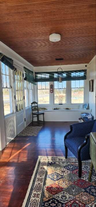 sunroom with wood ceiling