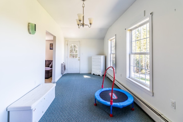 exercise area featuring a baseboard radiator, dark carpet, a notable chandelier, and lofted ceiling