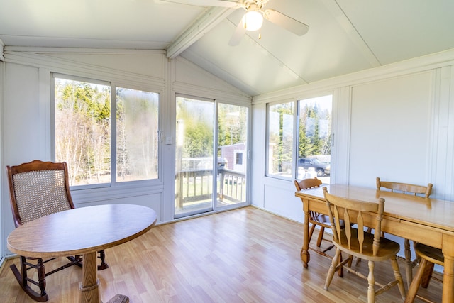 interior space with ceiling fan and vaulted ceiling with beams