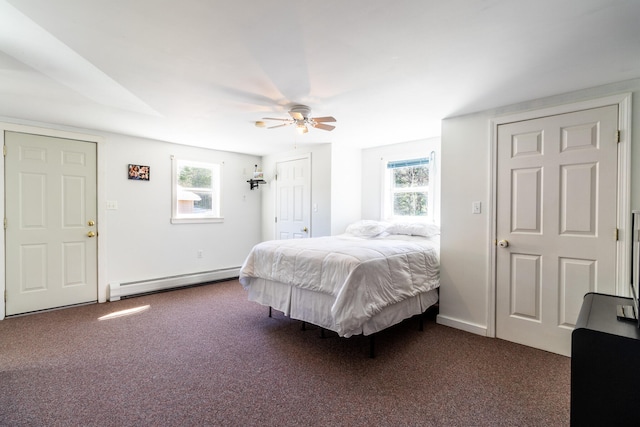 carpeted bedroom featuring ceiling fan and a baseboard radiator