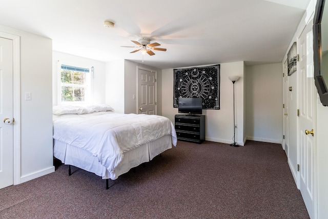 bedroom featuring dark carpet and ceiling fan