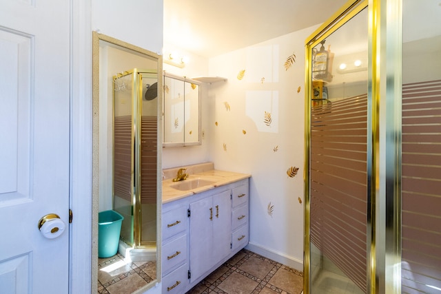 bathroom with walk in shower, vanity, and tile floors