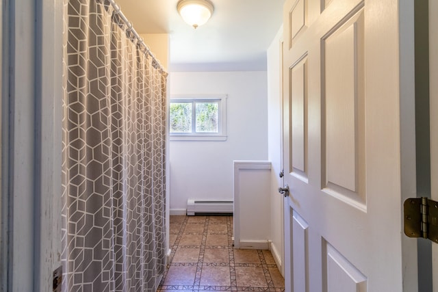 bathroom with tile floors and baseboard heating