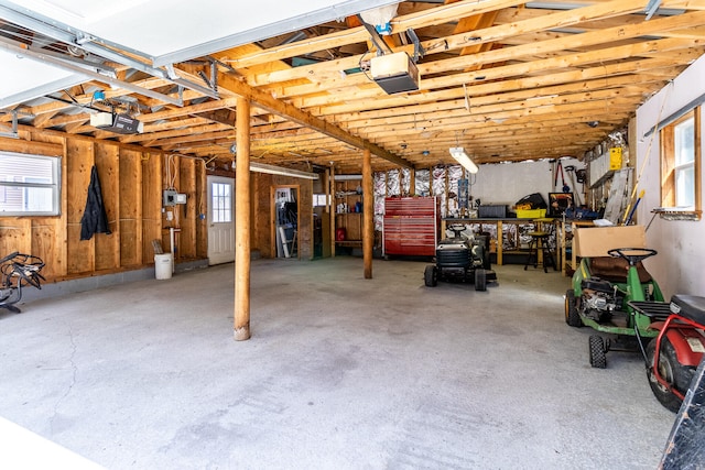 basement featuring a wealth of natural light and a workshop area