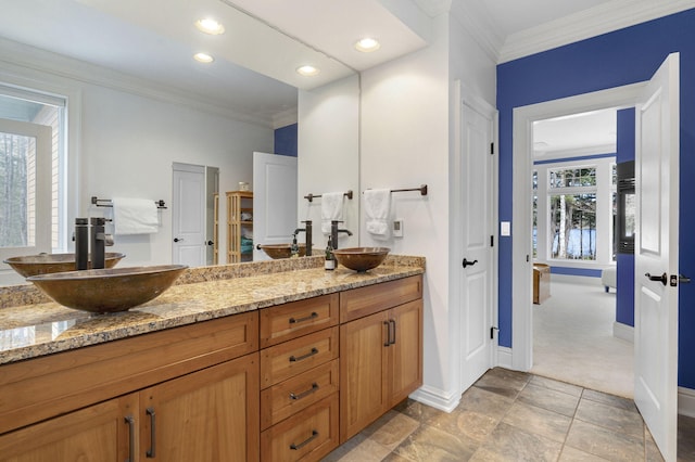 bathroom featuring vanity and ornamental molding