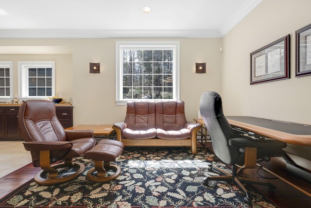 home office featuring hardwood / wood-style floors and ornamental molding