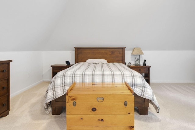 carpeted bedroom with vaulted ceiling