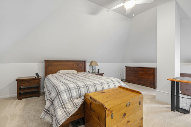 carpeted bedroom featuring lofted ceiling and ceiling fan