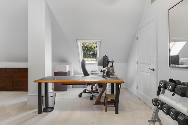 carpeted office space featuring vaulted ceiling