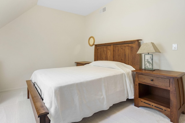 carpeted bedroom featuring vaulted ceiling