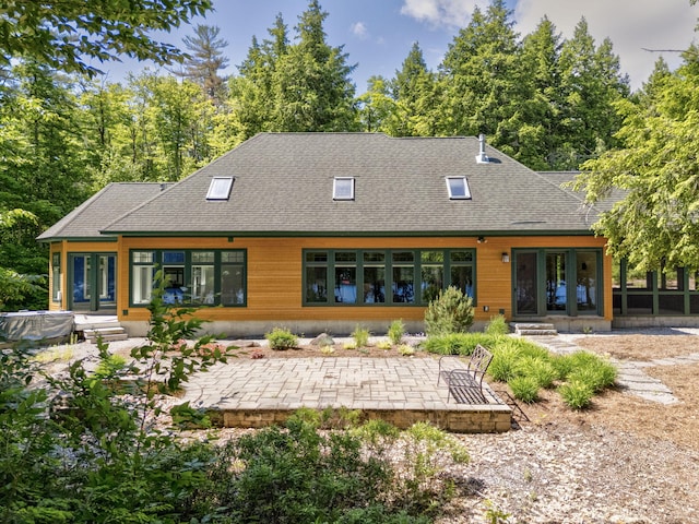 back of property with a patio and french doors