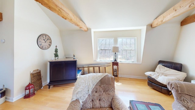 interior space with beamed ceiling and light wood-type flooring