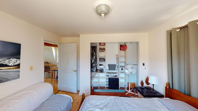 bedroom with a closet and light hardwood / wood-style floors