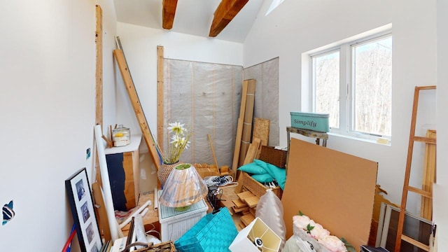 misc room featuring lofted ceiling with beams