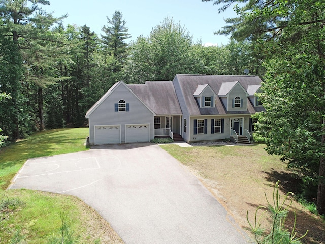 cape cod-style house with a front lawn and a garage