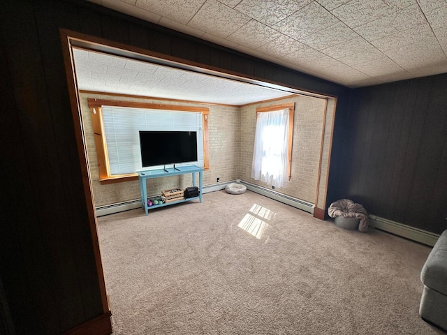 living room featuring carpet floors and a baseboard heating unit