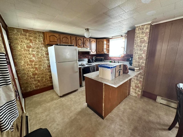 kitchen with wooden walls, baseboard heating, white appliances, light tile flooring, and kitchen peninsula